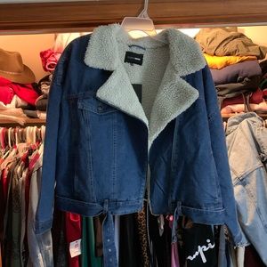 Medium wash denim jacket from Fashion Nova